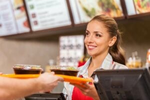 Fast Food Server Practicing Food Saftey After Getting Texas Food Handlers Certificate