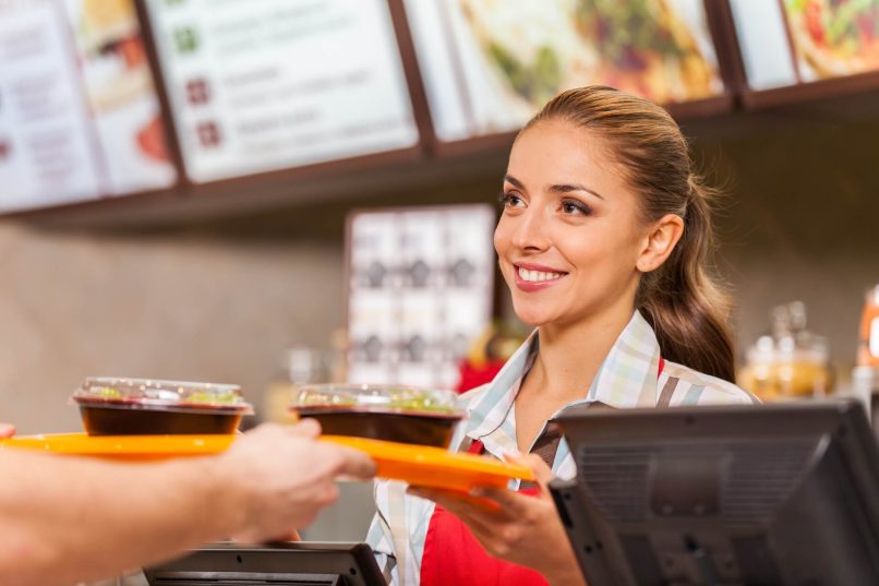 Fast Food Server Practicing Food Saftey After Getting Texas Food Handlers Certificate