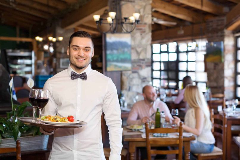 Waiter Serving Food & Alcohol has A TABC Certification & TX Food Handlers Card